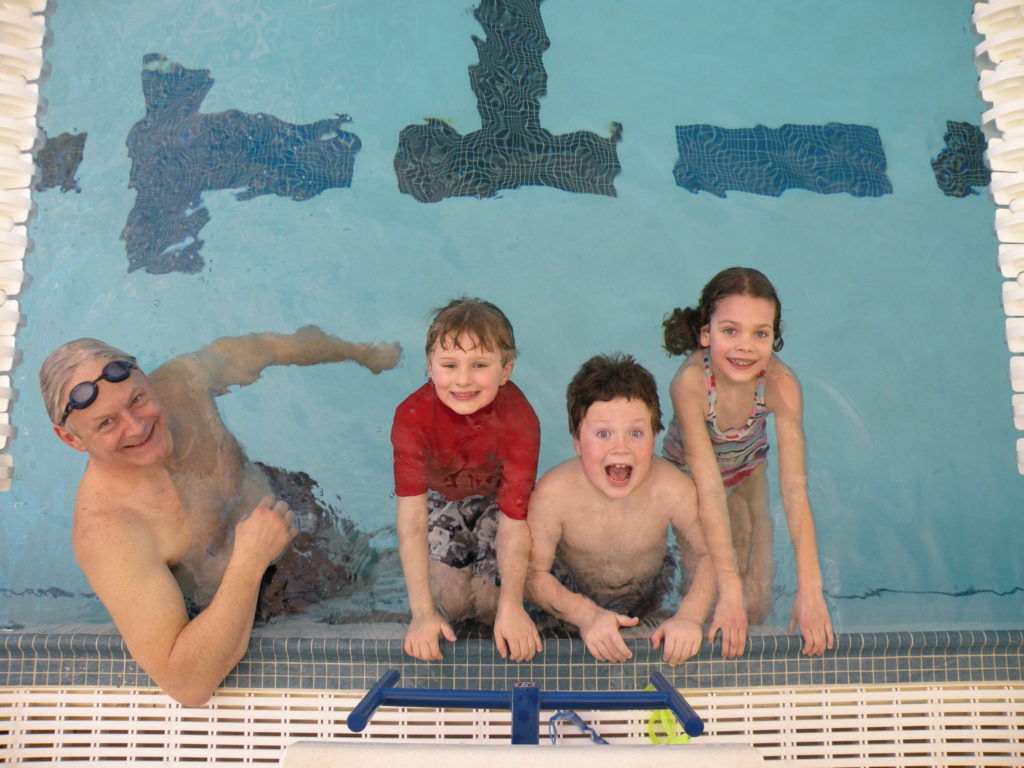 kids with swim instructor
