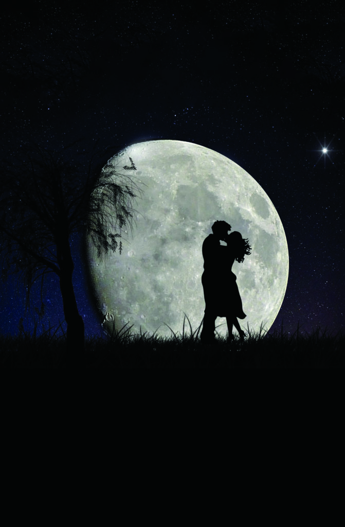 couple embracing in front of moon